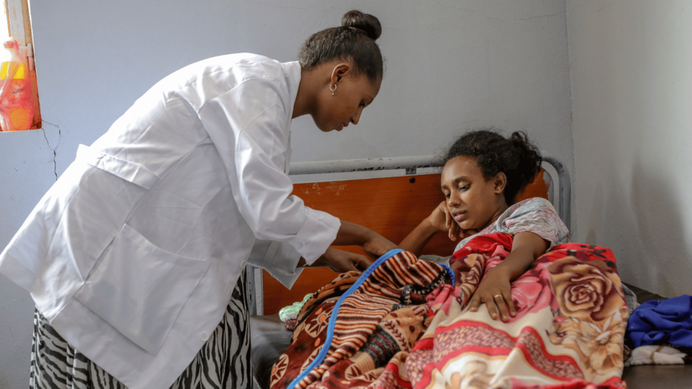 Midwife Abeba Bogale gently attends to a new mother and her baby at Metti Health Center, where she has spent the past six years delivering care to women in remote communities.