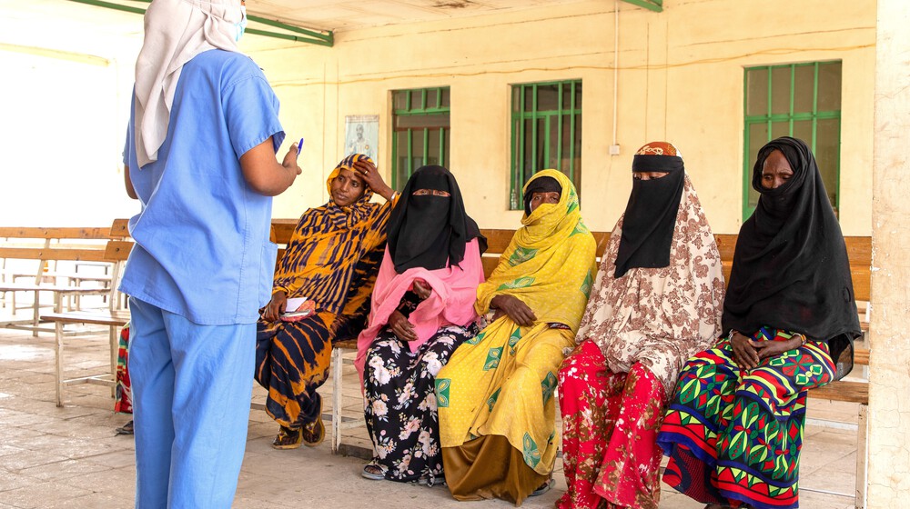 A nurse giving health education to a group of Afar women at a health institution