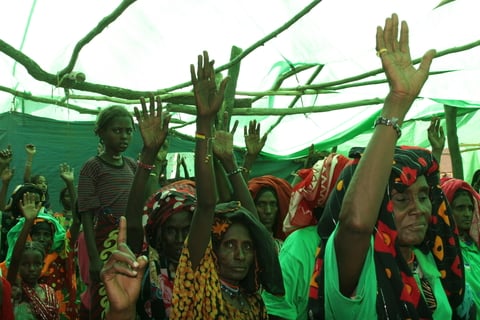 Ex-circumcisers symbolically renouncing FGM at a public declaration ceremony 