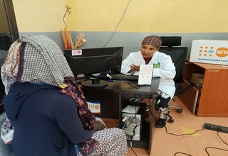 Almaz receiving counseling from a health professional at the one stop center