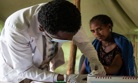 A UNFPA health extension worker providing health care services at a Mobile Health Unit in an IDP site in Amhara Region, Ethiopia