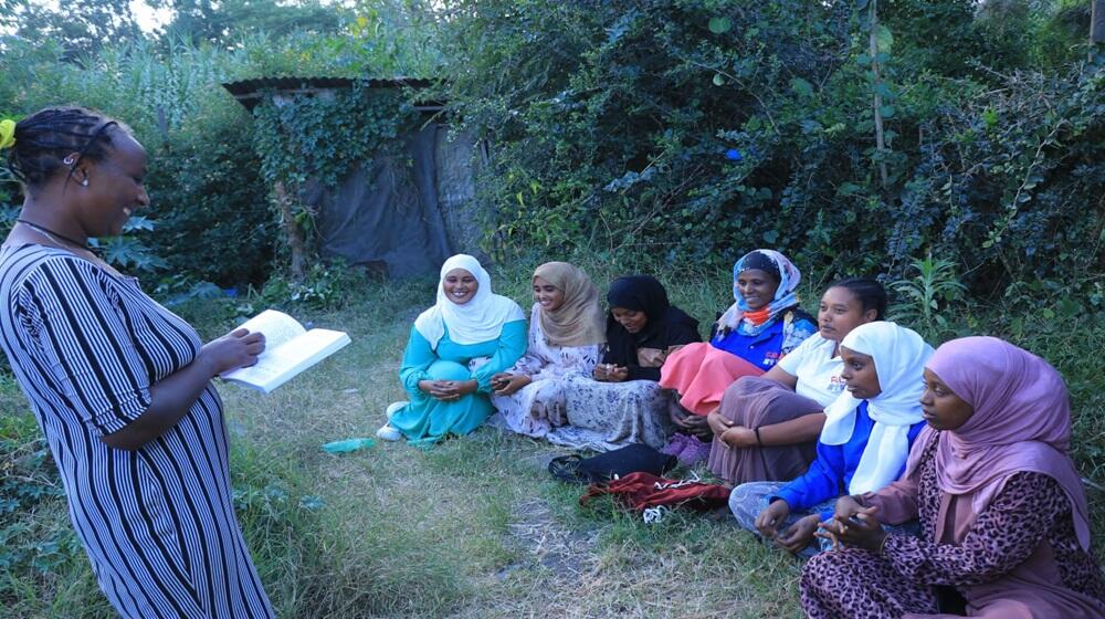 Amina facilitating a peer education session